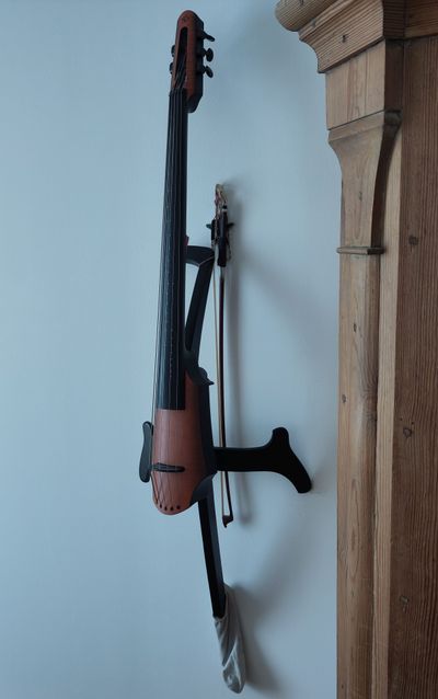 cello hanging on the wall - just grab and play!